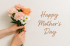 Mother’s Day Card – Hands Holding Flowers with Linen Background